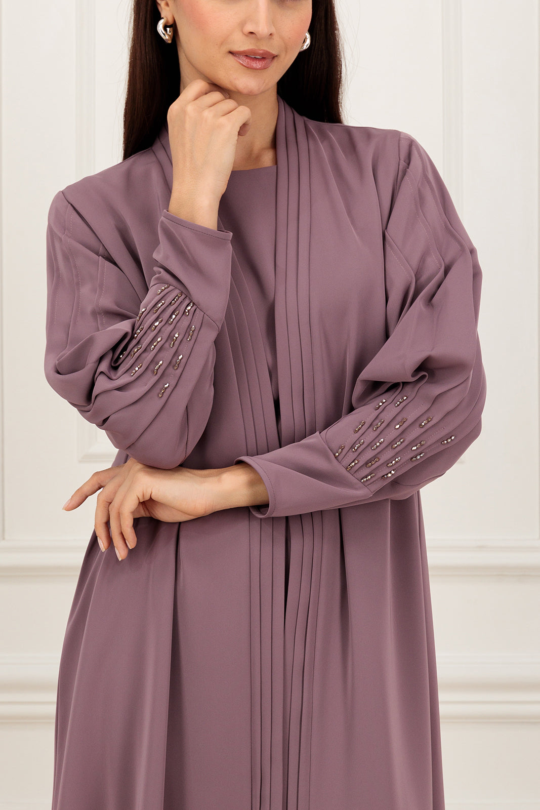 Pleated sleeves with embelishment
