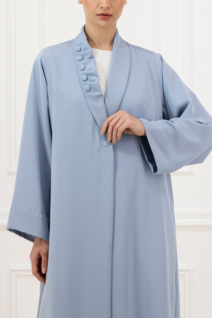 Asymmetrical pleated shawl collar with cover buttons
